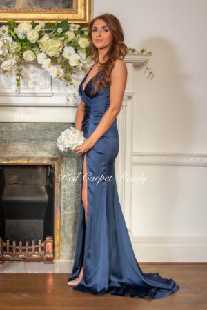 Sleeveless bridesmaids dress with a plunging neckline and leg split.