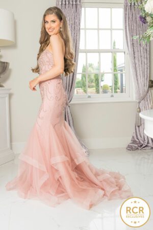 Blush pink fishtail dress with a v-neck and straps.