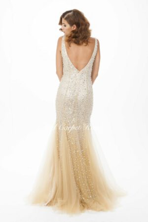 Nude coloured fishtail dress with silver crystal beading and a plunging back.