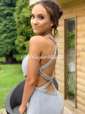 Slinky silver dress with cut-outs at the waist and crystal embellishments to the waist and neckline.