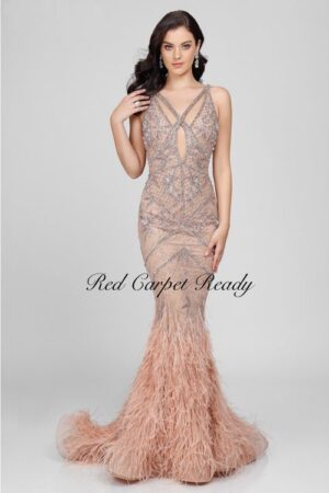Sleeveless fishtail couture dress with a feathered train and silver embellishments to the bodice.