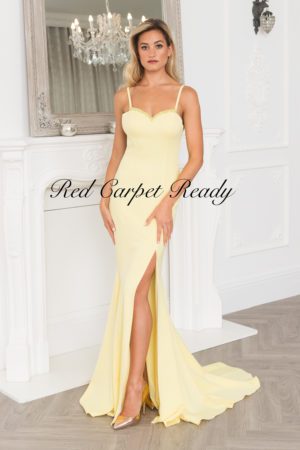 Yellow mermaid dress with a leg split and straps.