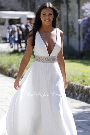 White A-line dress with a v-neck and waist belt.