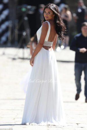 White A-line dress with an open back and waist belt.