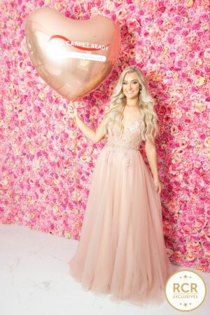 Blush pink a-line dress with sequin detailing and v-neck.