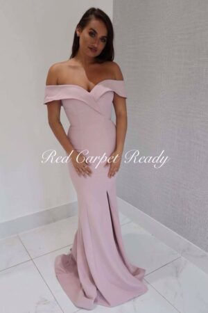 Off-the-shoulder mauve coloured dress which is tight fitting to the body.