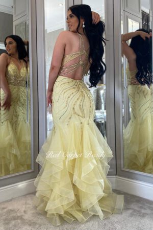 Floral embroidered sparkly yellow fishtail with a corset back and straps.