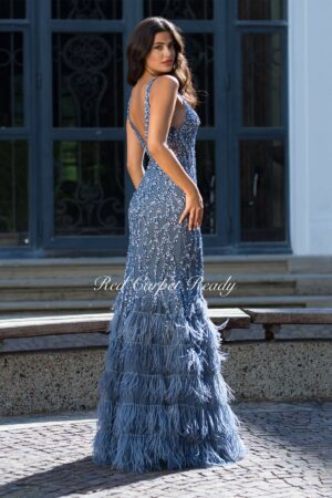 Tight fitting indigo dress with sparkly sequin embellishments, a feathered fishtail and an open back.