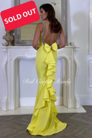 Yellow maxi length dress with cascading back detail.