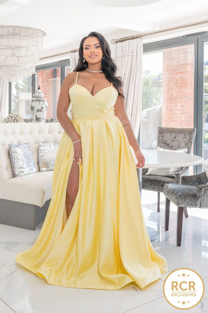 Yellow satin ballgown with a v-neck and straps.