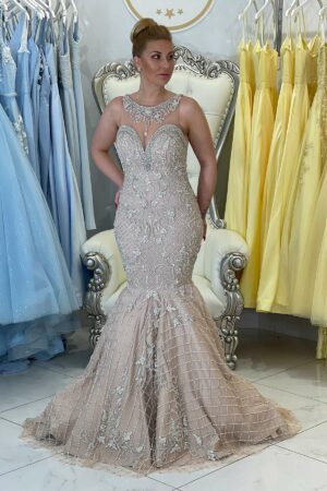 A premium quality, fishtail, hand-made Couture Gown with an encrusted neckline and nude front straps.