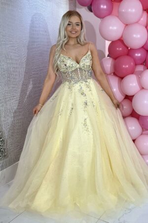 Lemon ballgown featuring sparkly silver embellishments to the sheer corset style bodice and skirt.