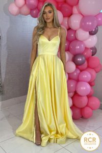Yellow satin ballgown with a v-neck and straps.