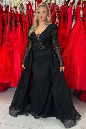 black long dress with a cape, embroidered detailing and sleeves