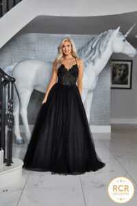 This long, sleeveless ballgown will turn heads with its shimmering detailed bodice and long flowing skirt.