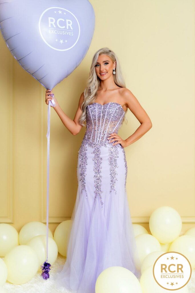 Strapless fishtail prom dress with embellished details on the bodice and waistline.