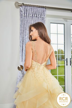 yellow ruffle ballgown with a crystal encrusted bodice & a low back