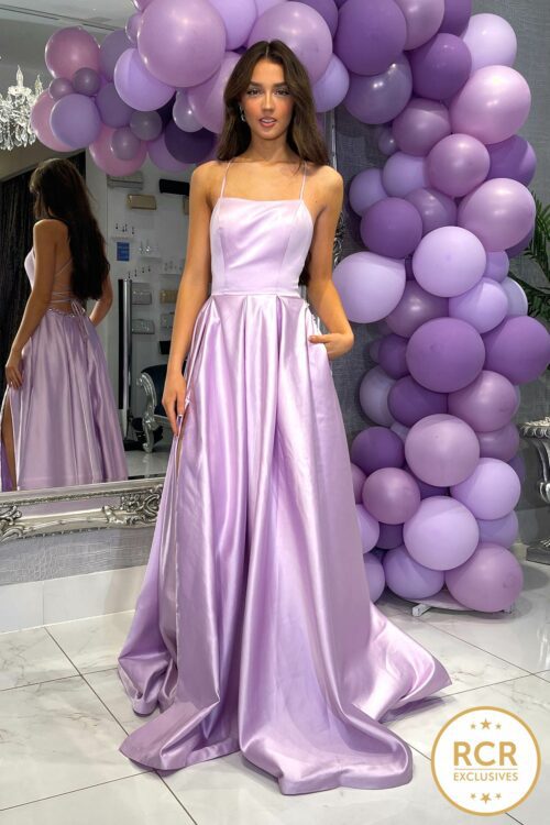 A Satin Ballgown Prom dress with an open laced back, detailed waistband and straps.