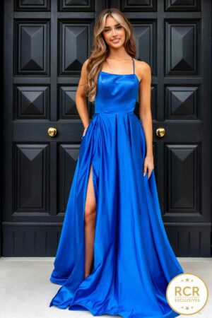 A Satin Ballgown Prom dress with an open laced back, detailed waistband and straps.