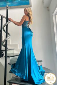 Satin prom dress with a lace up corset that cinches in to show off your figure, with a flowy skirt and train