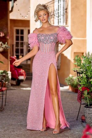 A fully embellished couture off the shoulder gown with feathered detailing and a rhinestone corset.