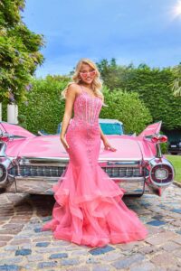 Pink fishtail prom dress with a ruffle bottom and a corset bust
