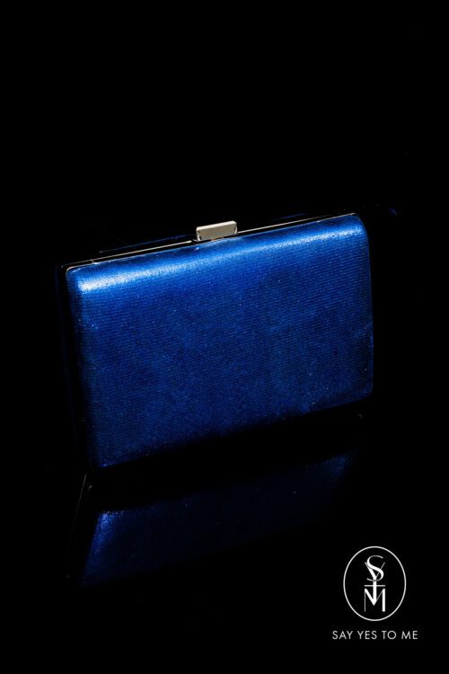 'SIENNA' in royal blue is a rectangular shaped clutch bag with a sleek and sophisticated look with a metallic-like finish to add a touch of glamour to your look.