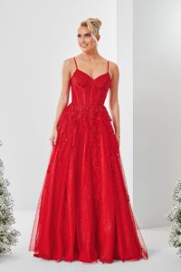 A red A-line prom dress with a stunning flower embellished corset top and glittery skirt.