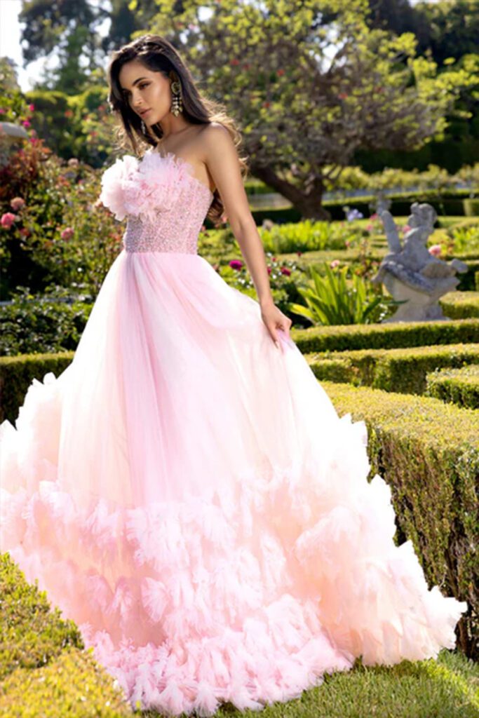 A Blush ballgown that provides plenty of volume, complete with layered ruffles and a detailed bodice.