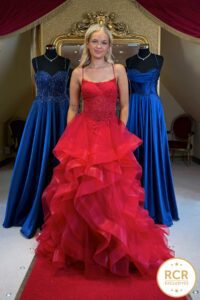 A wine Princess Prom Dress with tiered ruffles and a beautiful detailed bodice with a coreset back.