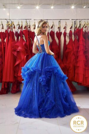 An royal blue sparkly ruffle ballgown with a structured mesh corset bodice decorated with delicate gems.