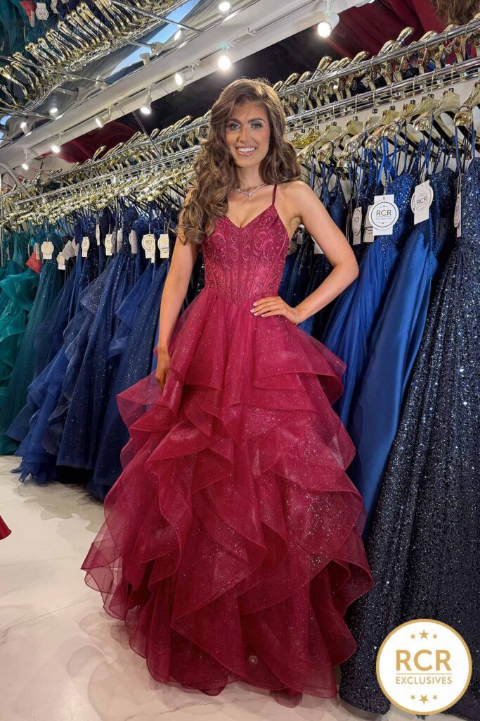 HARPER is a tiered ruffle glittery skirt with a laced embroidered detailed bodice and a lace corset back.