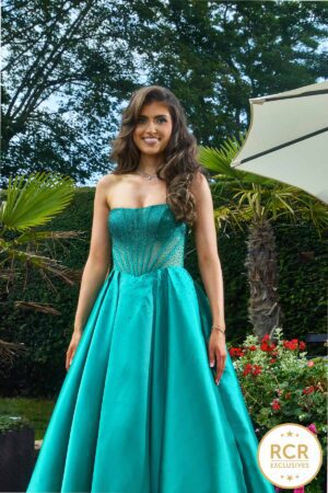 A teal strapless satin princess dress, with a corset structure top embellished with ombre jewels and zip back.