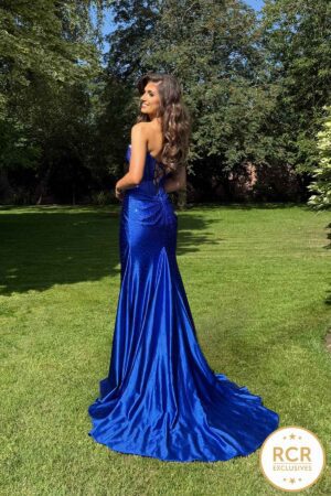 A slinky prom & evening dress with a gem encrusted bodice that continues in an ombre down the dress to the leg split.