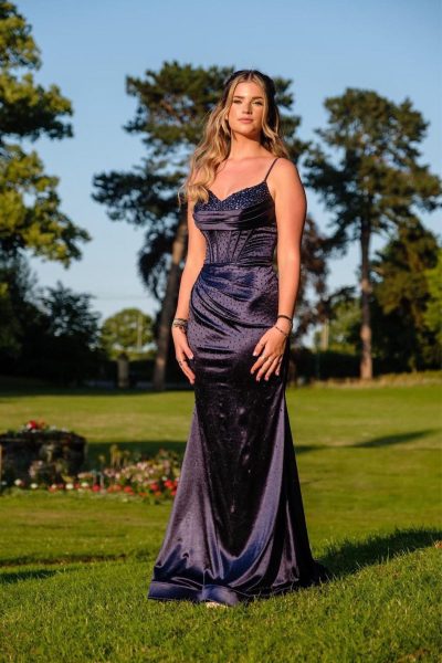 A navy fishtail crystal encrusted prom & evening dress with a corset back.