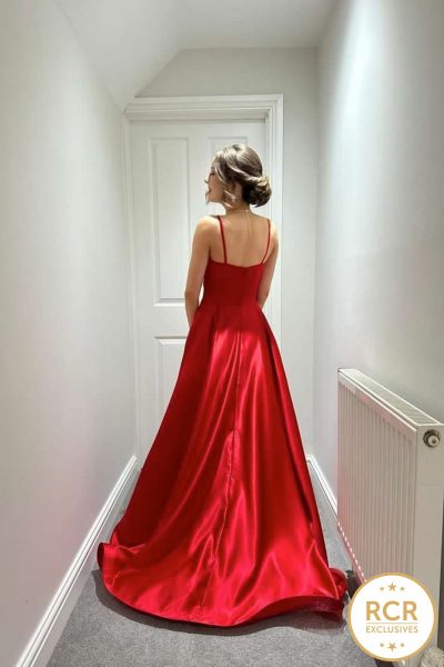 a classic cherry red flowing hollywood look dress with a leg slit